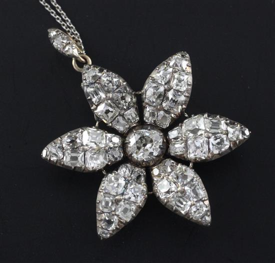 A Victorian gold, silver and diamond encrusted flower head pendant, pendant overall 1.5in.